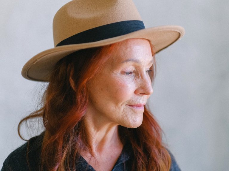 pexels-photo-5257501 senior woman with wrinkles and red hair in hat