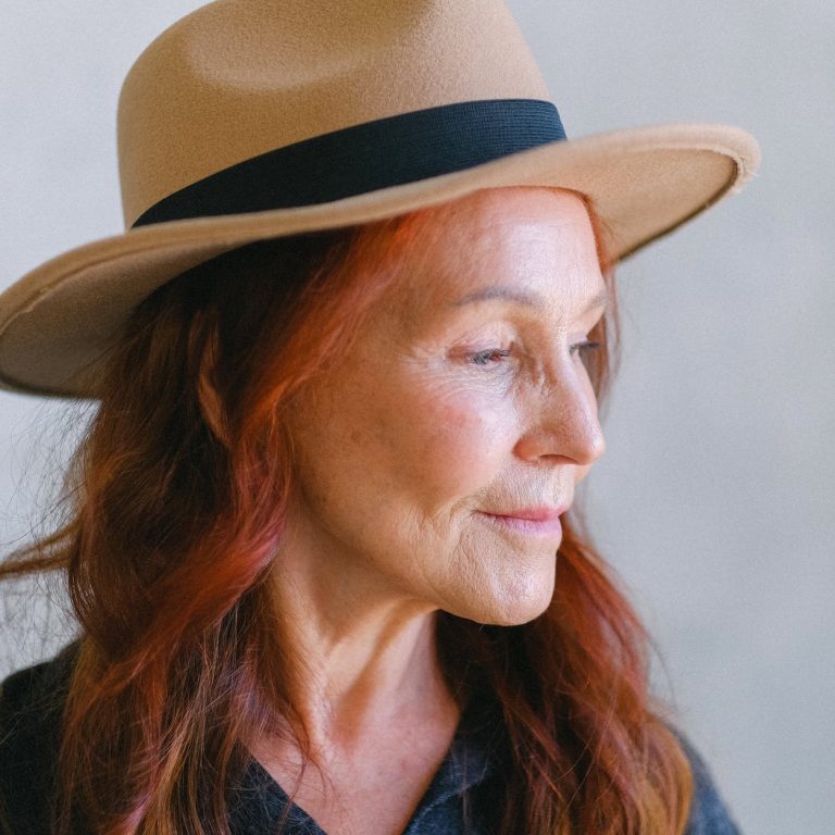 pexels-photo-5257501 senior woman with wrinkles and red hair in hat