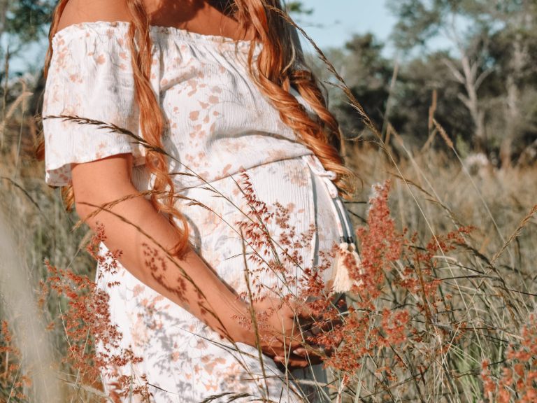 pexels-photo-8975712 pregnant woman in grassfield