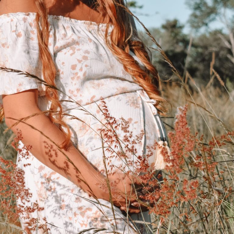 pexels-photo-8975712 pregnant woman in grassfield
