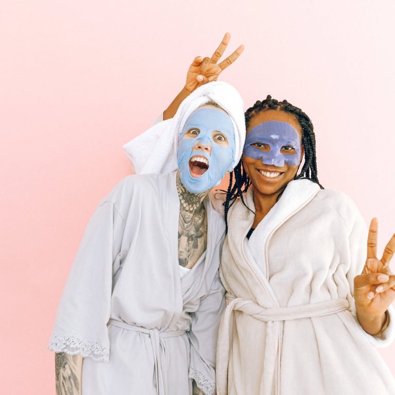 pexels-photo-3852150 happy multiethnic female friends in sheet masks showing peace gesture