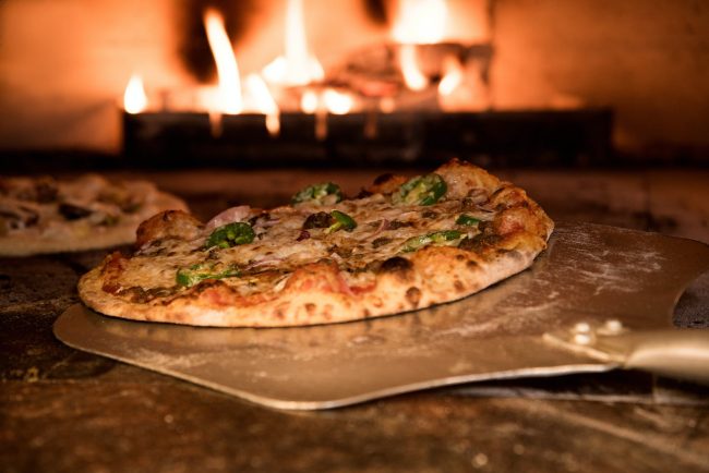 pexels-photo-905847 baked pizza on pizza peel in oven