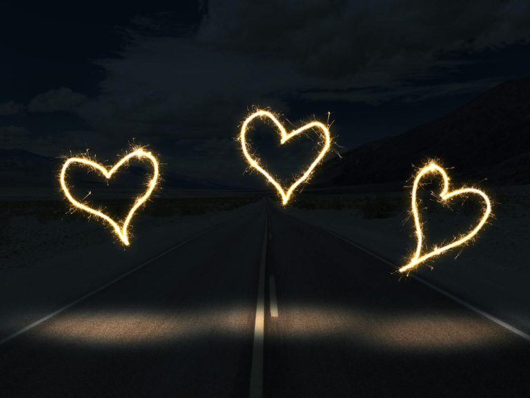 pexels-photo-3633016 white light forming heart on black surface