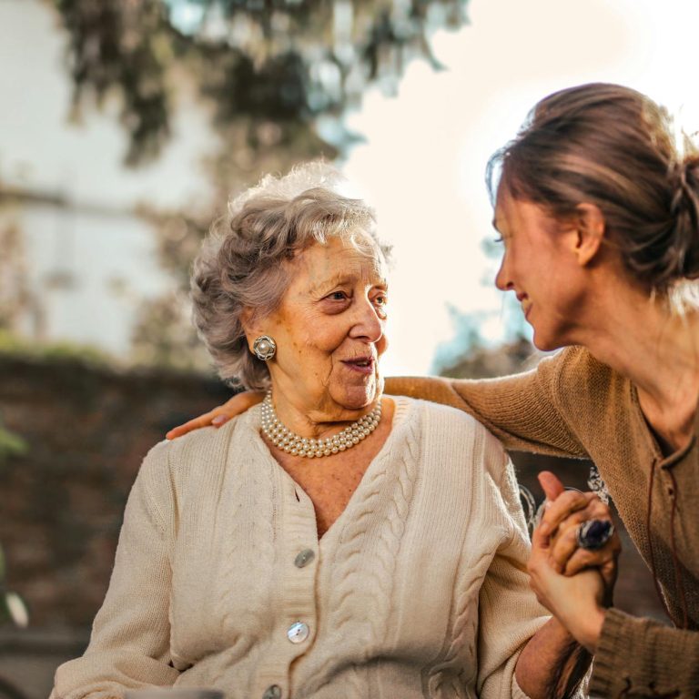 pexels-photo-3768131 joyful adult daughter greeting happy surprised senior mother in garden