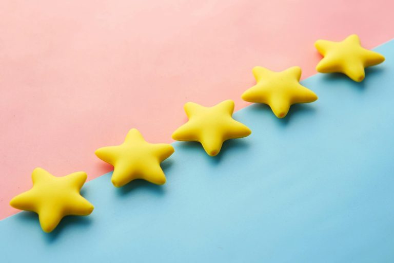 pexels-photo-9821386 five yellow stars on blue and pink background