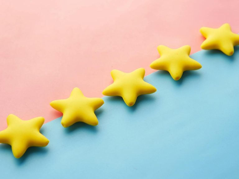 pexels-photo-9821386 five yellow stars on blue and pink background