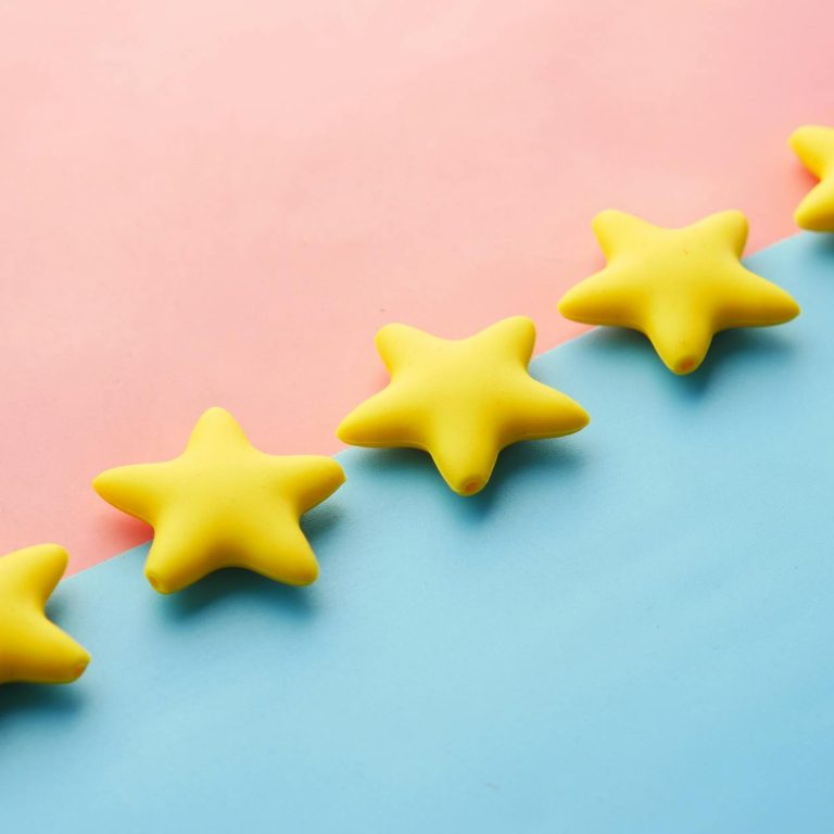 pexels-photo-9821386 five yellow stars on blue and pink background