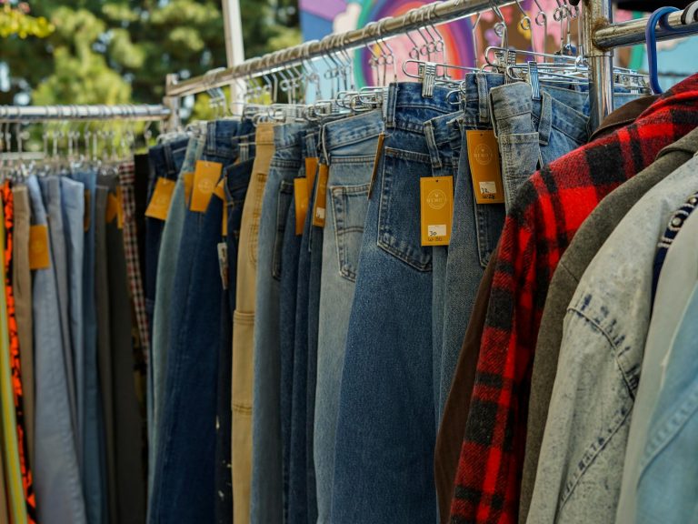 pexels-photo-16729453 close up of clothes with price tags hanging on a clothing rack at a flea market