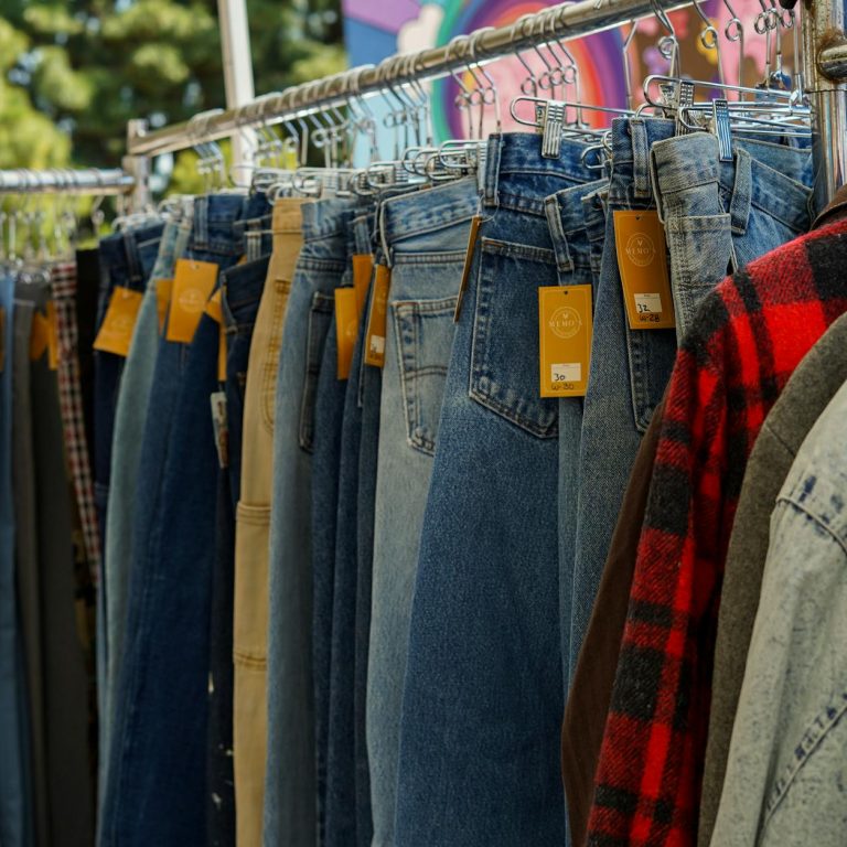 pexels-photo-16729453 close up of clothes with price tags hanging on a clothing rack at a flea market