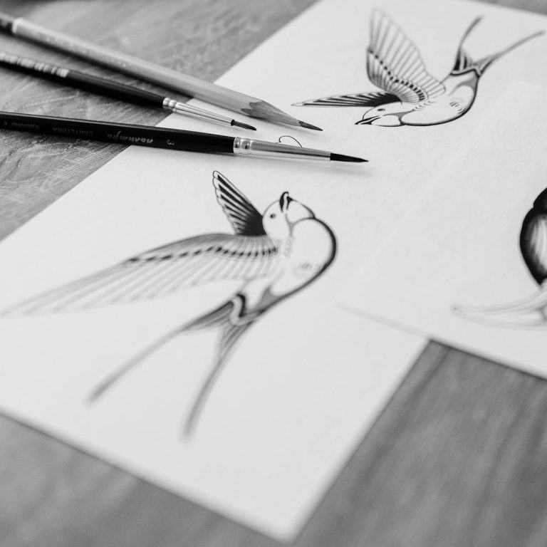 pexels-photo-6593531 black paintbrushes on top of white paper